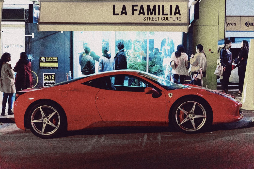 Red Ferrari 458 outside La Familia Street Culture at night, Rosebank, July 2018