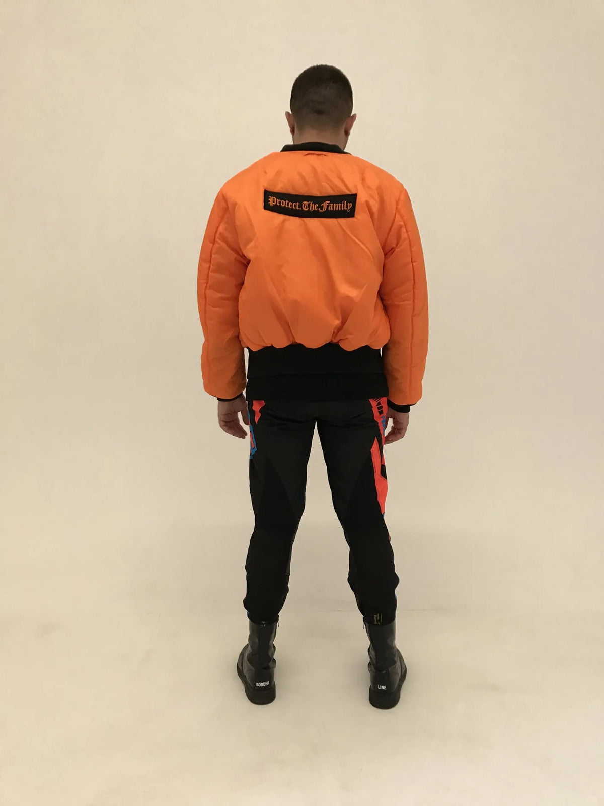 Protect The Family x Alpha Industries bomber, orange side, back with the Protect.The.Family badge, lookbook 2017