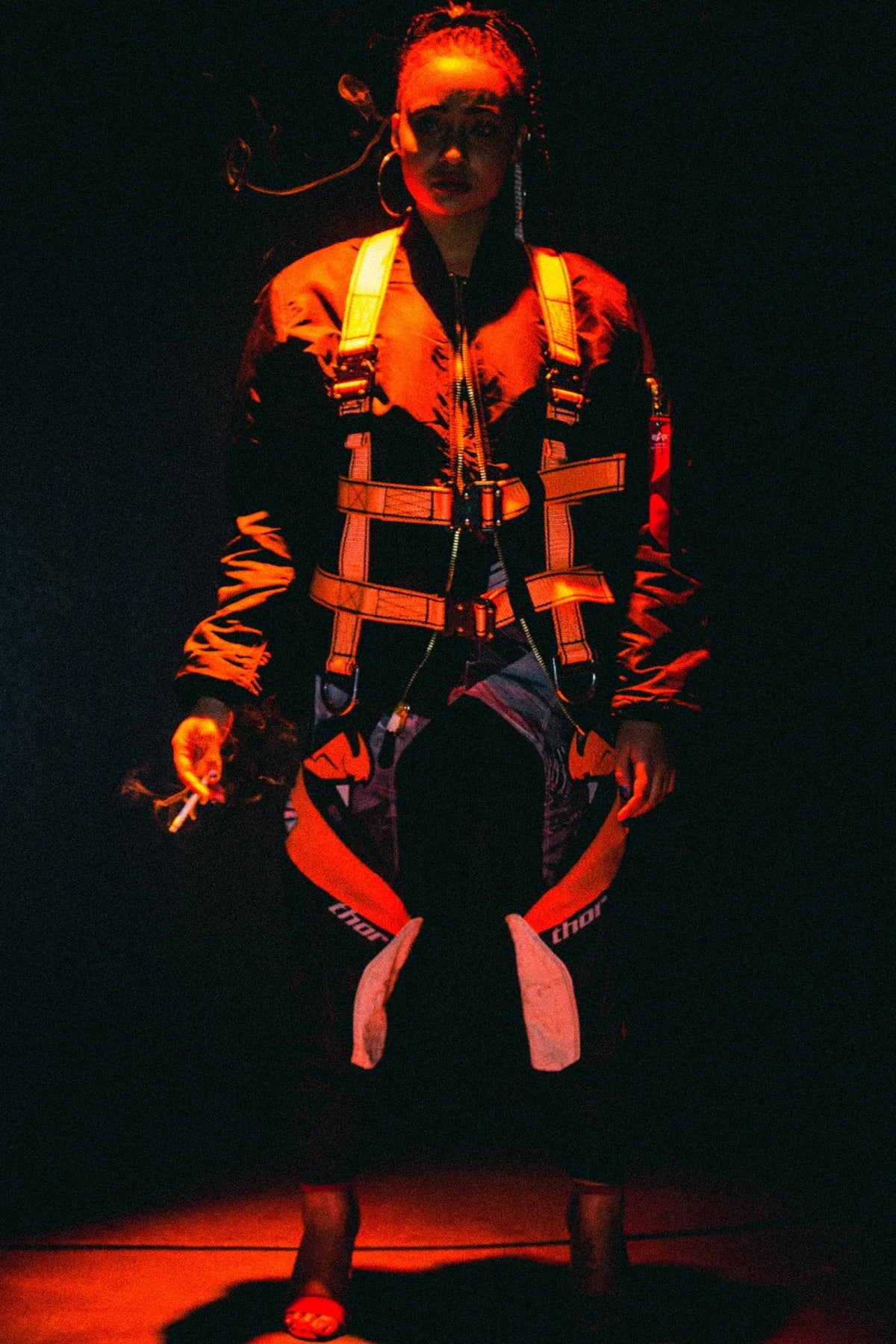 Model in the Protect The Family harness bomber in a spotlight, July 2017