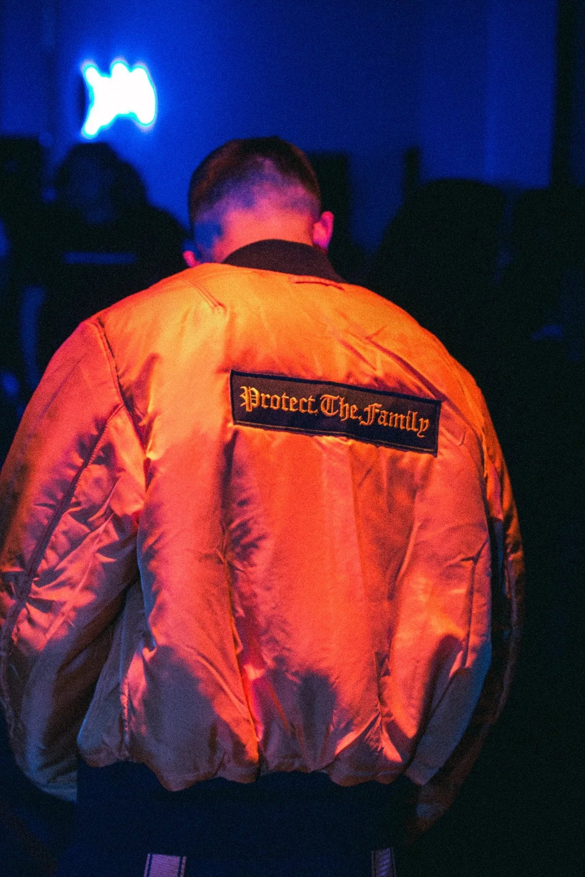 Protect.The.Family badge on the back of the orange bomber, launch night, Rosebank, July 2017