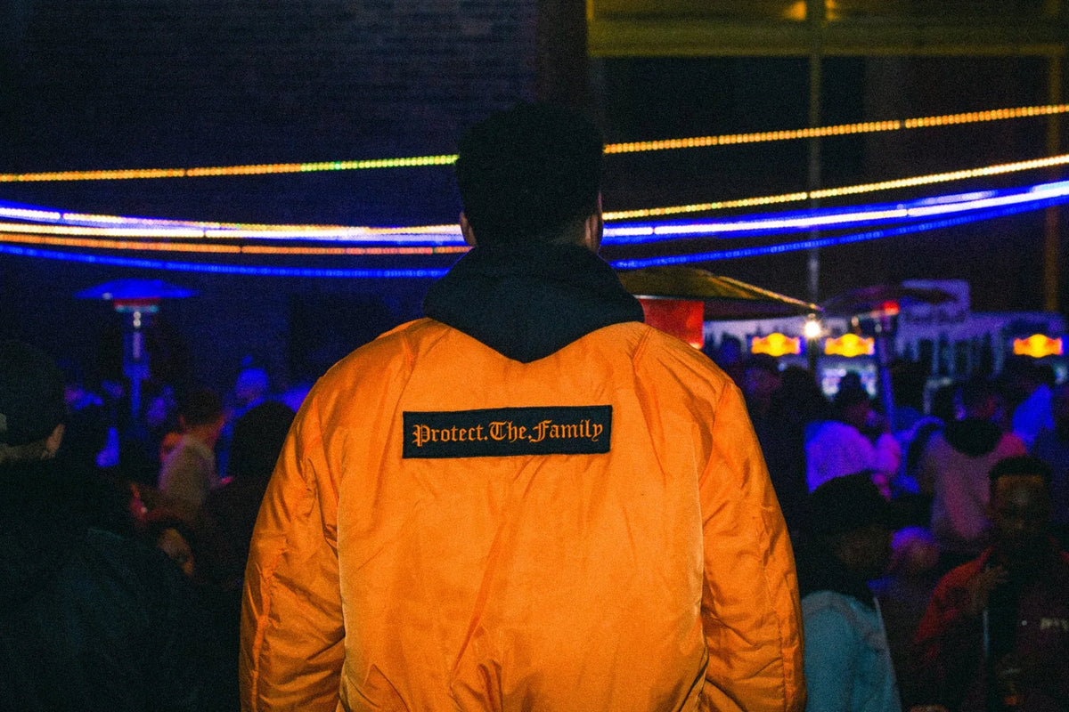 Guest in the orange Protect The Family bomber at the launch, Rosebank, July 2017