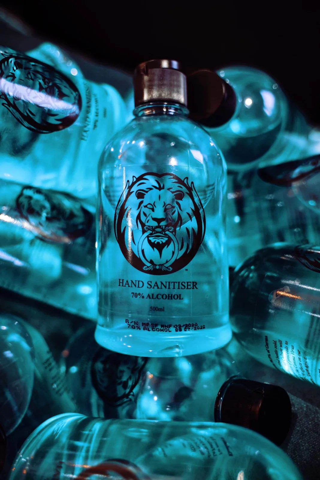 La Familia x Flo hand sanitiser bottles with the La Familia lion