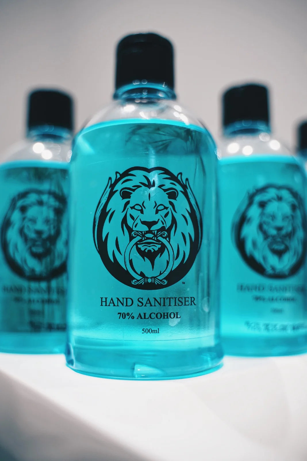 Three La Familia x Flo 70% alcohol hand sanitiser bottles